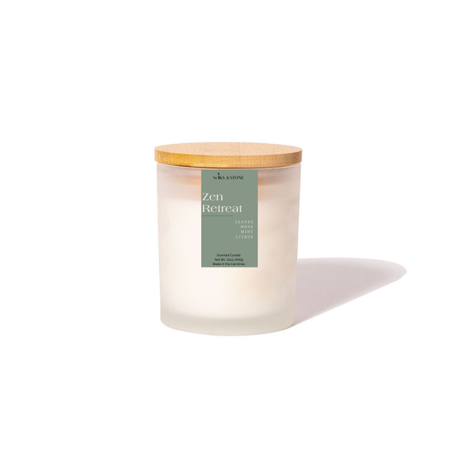 Zen Retreat Scented Candle with notes of mint, citrus, leaves, and moss, in a 12oz jar with wooden wicks.